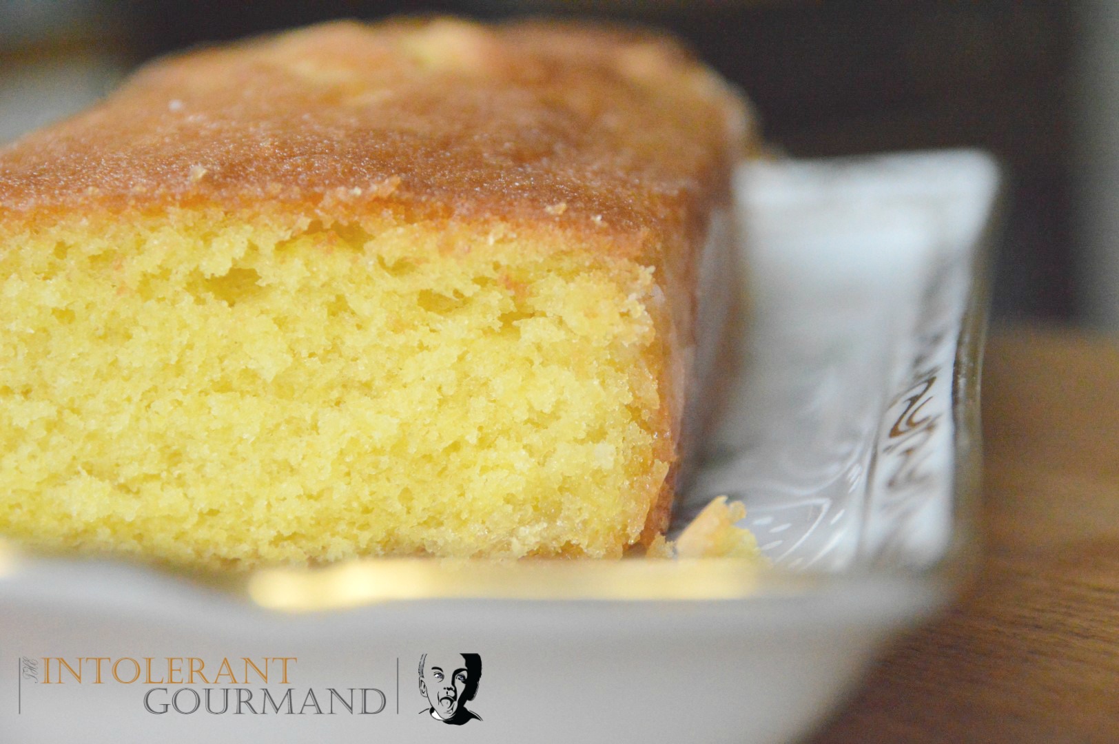 Gluten free dairy free lemon drizzle cake - a deliciously light and fluffy sponge made with Free From Fairy flour www.intolerantgourmand.com