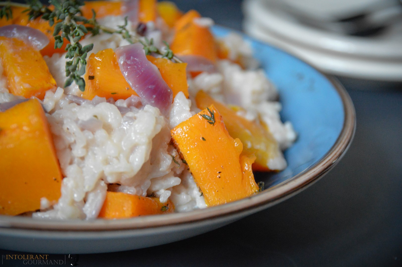 The Best Pumpkin Risotto - the perfect recipe for harvest time! It uses the iconic pumpkin, autumnal produce at its finest! Paird with creamy a2 milk, subtle thyme undertones and finished with a little goats cheese. Comfort food doesn't get much better! www.intolerantgourmand.com
