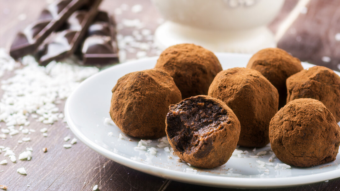 Vegan Chocolate Coconut Truffles - decadent truffles, made with dairy-free chocolate and coconut for the ultimate Valentines Day indulgence. Simply make just because, or for a last minute present! www.intolerantgourmand.com