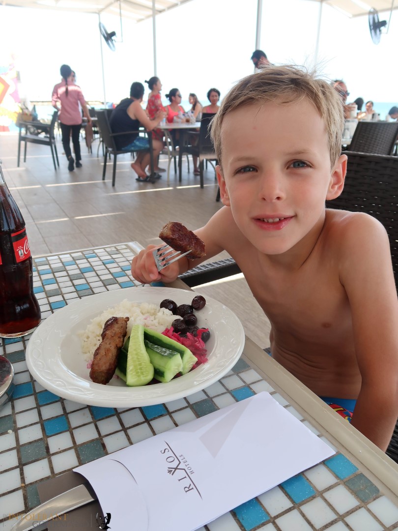 Rixos Sungate Kemer Antalya with Jet 2 Holidays - little boy eating lunch, salad on a plate, restaurant on the beach. www.intolerantgourmand.com
